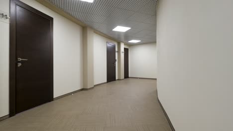 modern empty office corridor with brown doors