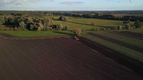 majestic aerial view flight drone shot footage from above of a
tractor on autumn field in brandenburg havelland germany at summer 2022