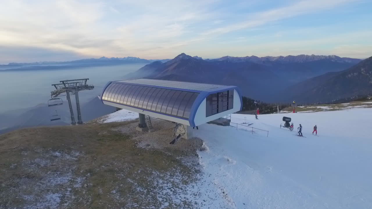 Panoramic Aerial Ski lift and Ski area view. Clouds and mountain. Daytime. Krvavec, Slovenia