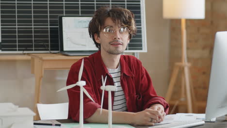 portrait of renewable energy engineer at office workplace