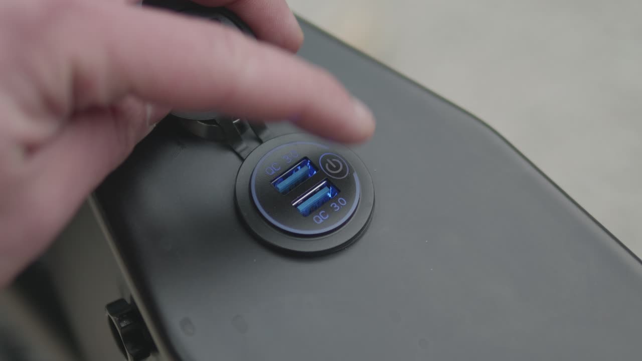 Close-up of the charge port of an enduro e-bike.