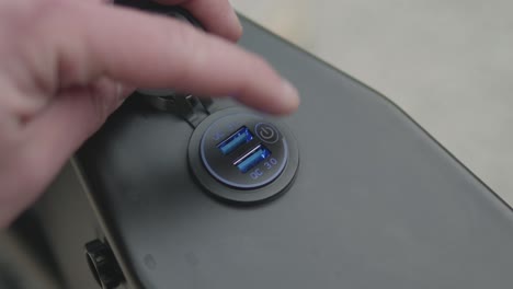 Close-up of the charge port of an enduro e-bike.