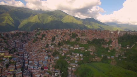 Drone-aerial-view-of-Petare-slum,-in-Caracas,-Venezuela,-during-a-sunset