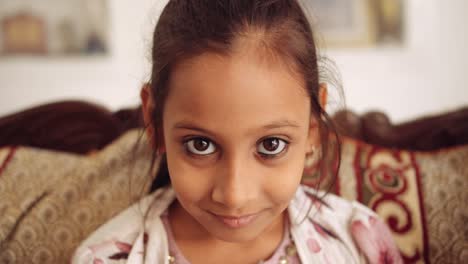 portrait of an indian child at home during coronavirus lockdown