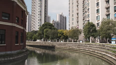 Urban Canal Scene with Buildings and Trees