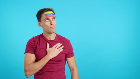 Man listening to the Venezuela national anthem with solemnity