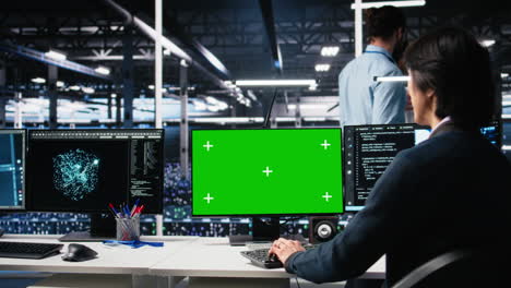 technician in data center coding with generative ai on green screen pc