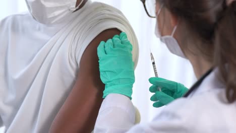 young man visits skillful doctor at hospital for vaccination