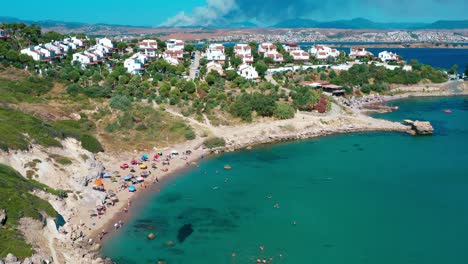 4k aerial footage taken by drone of people sunbathing on the beach and swimming in the sea in izmir-turkey