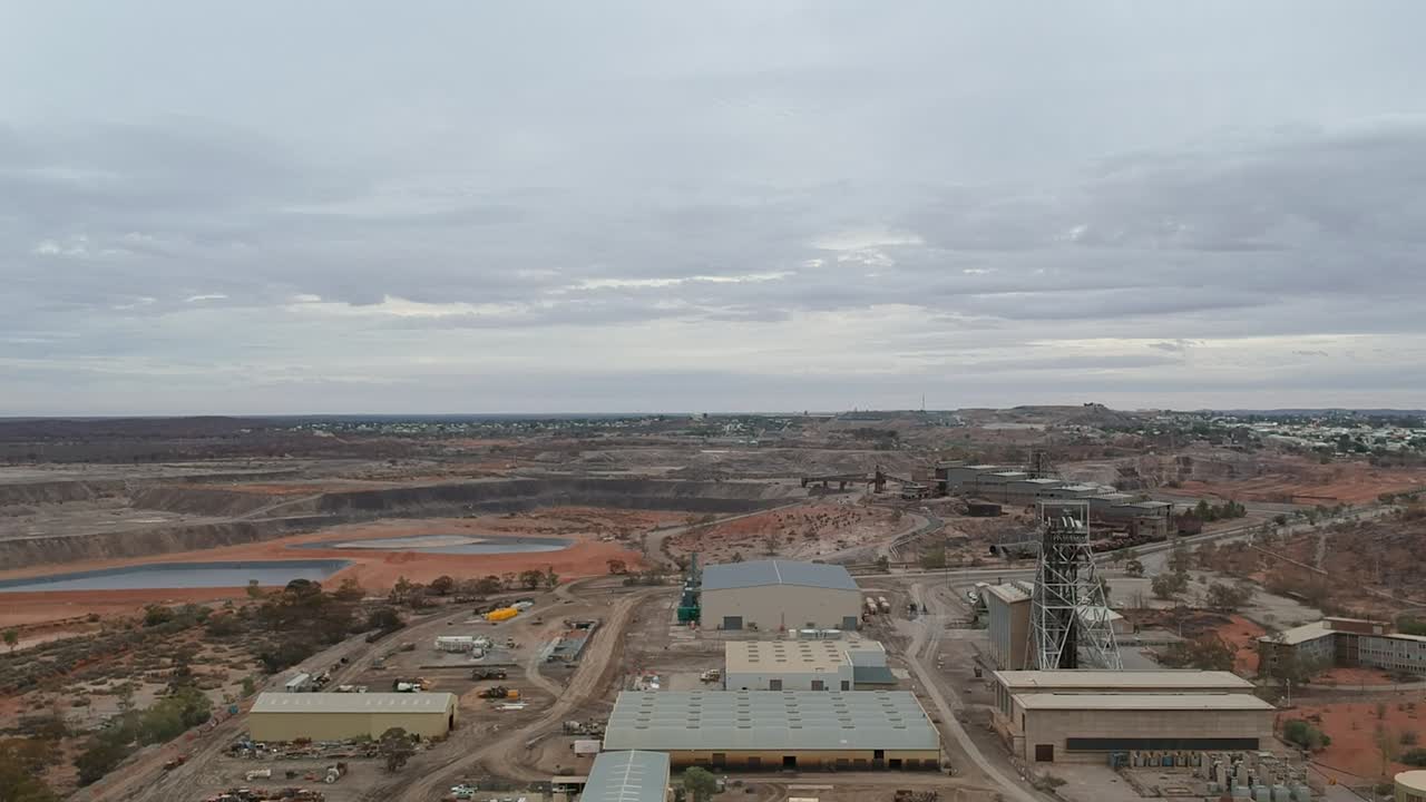 Flying over a broken hill mine site