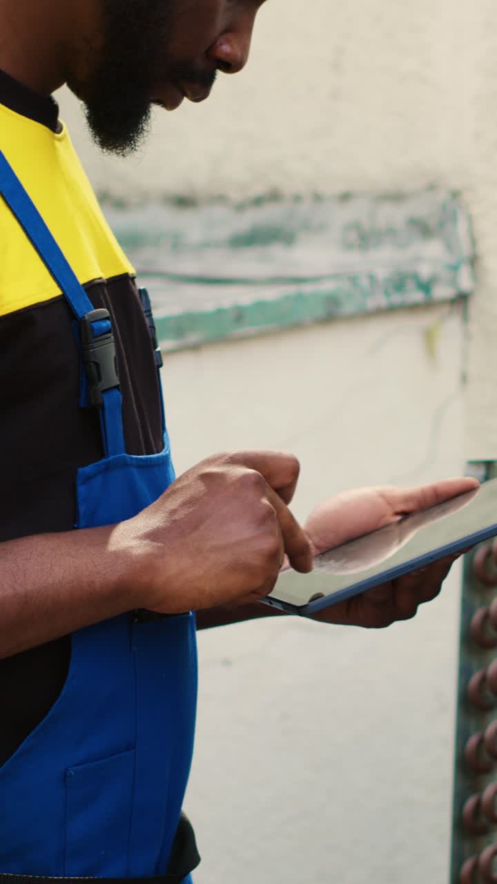 Vertical video Repairman inspecting refrigerant levels