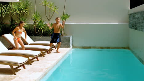 Siblings-diving-into-the-swimming-pool