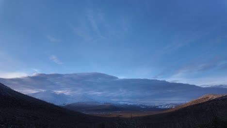 witness the dramatic transformation as clouds gracefully sweep across the mountains and valley, capturing the beauty of nature's ever-changing moods throughout the day