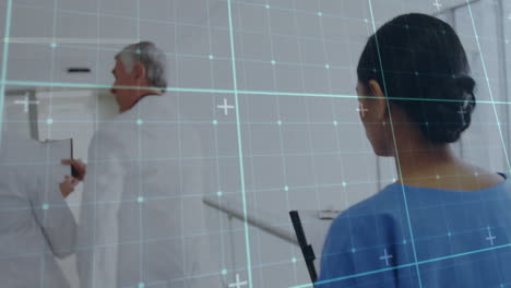 medical data processing animation over healthcare professionals in hospital corridor