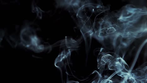 Smoke-rising-on-black-background