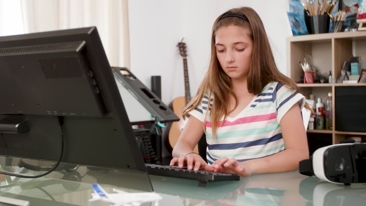 Girl using VR headset at desk