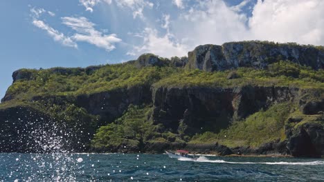 Low-angle-view-from-tourist-boat-of-Las-Galeras-headland-promontory-and-cliffs-in-Dominican-Republic