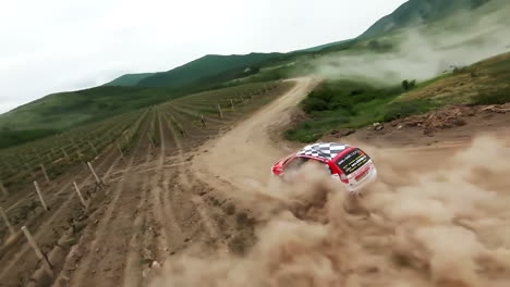 rally car driving on a dirt road