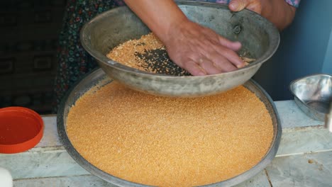 senior woman is making tarhana with her hands using traditional method