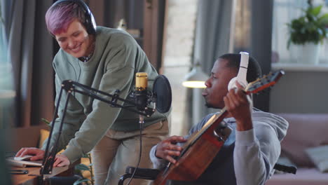 musician in wheelchair collaborating with other musician