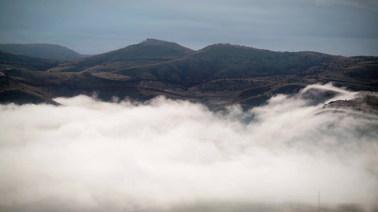 Low Clouds Moving Over Rolling Hills and Rural Landscape