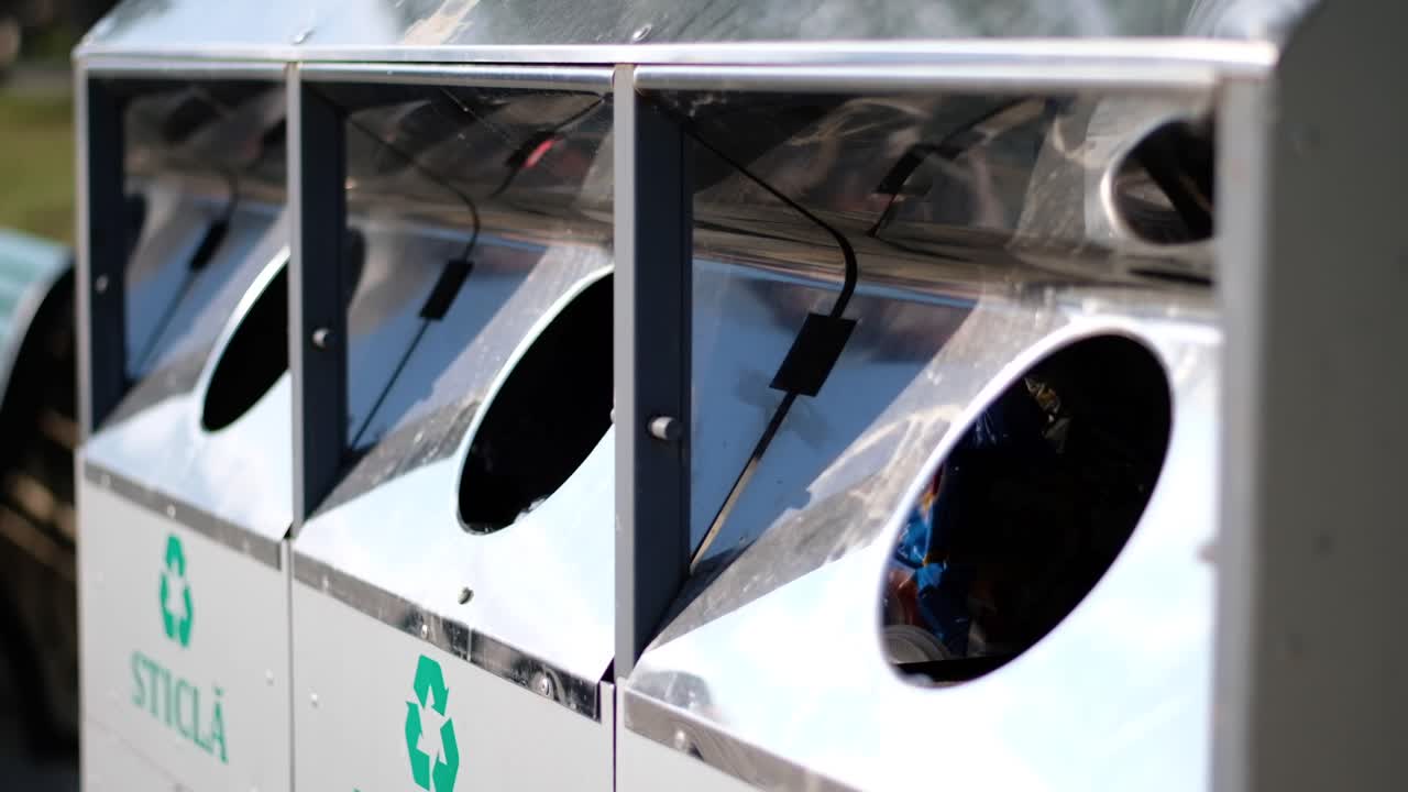 Young man walking in the park with a cup of ice coffee and bamboo straw