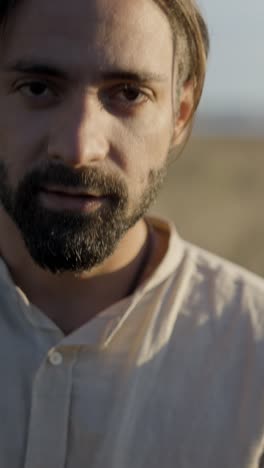 close-up portrait of a contemplative man with a beard