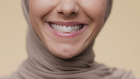 close-up of a smiling woman wearing a hijab