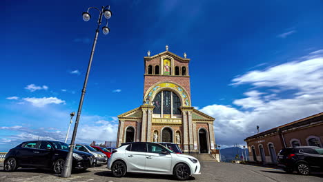 fast moving cloud time lapse with cathedral of tindari in foreground in italy at basilica santuario maria