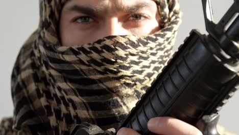 portrait of soldier holding rifle