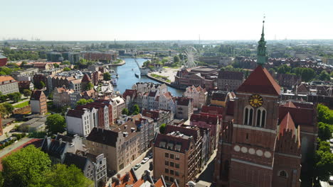 smooth aerial dolly in over the old town of gdansk and the river