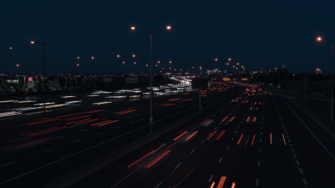 Night timelapse of Hwy 401 in Ontario, cars streaking by in motion