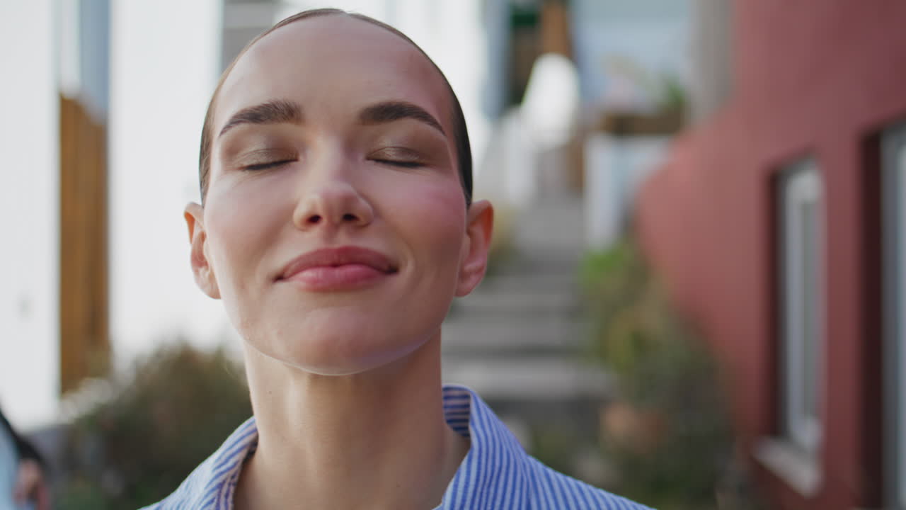 Relaxed tourist looking camera resting at old town street portrait. Lady walking