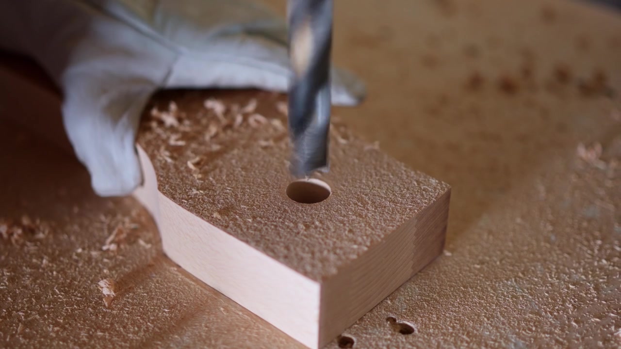 Close up of drill bit making a hole in wood