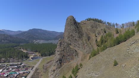 aerial view of a mountain with a rock formation