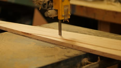 pine plank cutting, bandsaw in action woodworking