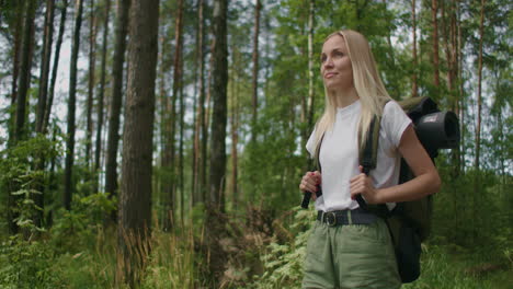 SLow-motion:-Portrait-Traveling-Happy-Caucasian-woman-with-backpack-walking-on-path-the-tropical-forest