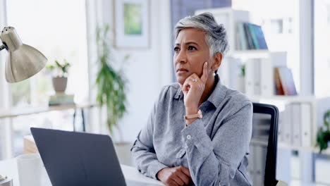 Senior woman, laptop and office with thinking