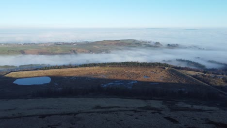 lancashire farming countryside aerial cloudy misty shadowy valley moorland hillside landscape slow right dolly