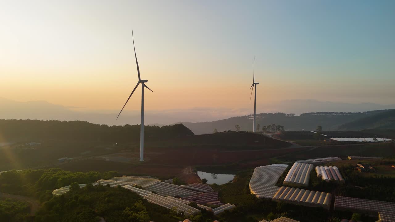 Wind turbines on the mountain in the beautiful sunrise morning - Vietnam