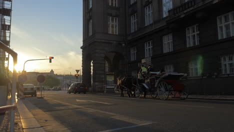 prague street with car and horse carriage