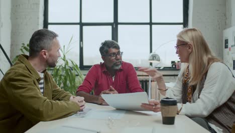 senior businesswoman discussing renewable energy project with team