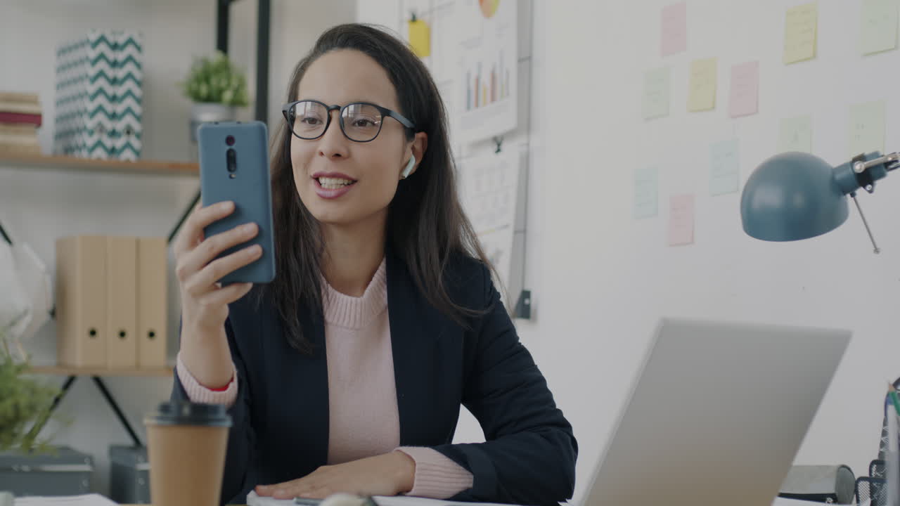 Business Woman on Video Call in Modern Office