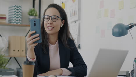 business woman on video call in modern office