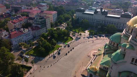 Drone-flight-over-a-classical-European-square-with-old-buildings-and-an-Orthodox-Cathedral-in-Sofia,-Bulgaria