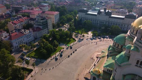 drone flight over a classical european square with old buildings and an orthodox cathedral in sofia, bulgaria