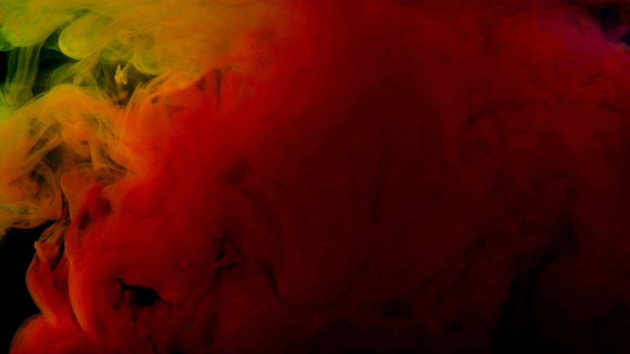 Abstract forms. Shooting on a black background. Mixing of paints