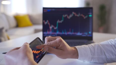 man examining stock market sales statistics.