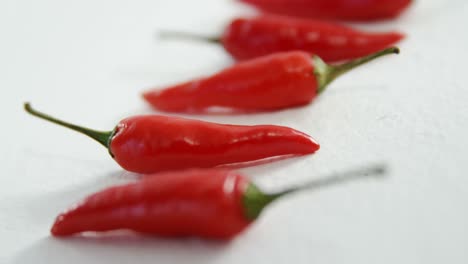 red chili peppers on white background 4k