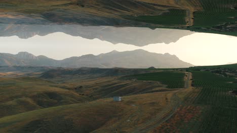 inverted mountain valley landscape with reflections